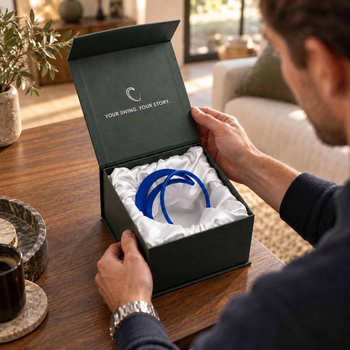 Blue custom swing sculpture presented in its finished sculpture box